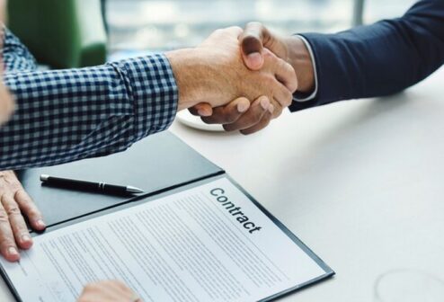 two-men-shaking-hands_53876-63180